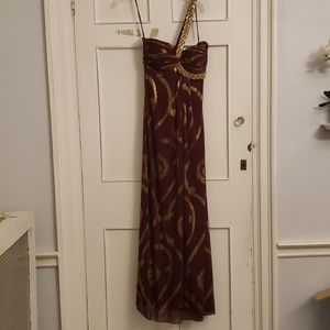 Maroon with gold single shoulder gown